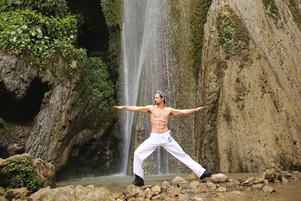 Yoga pose near waterfall 2